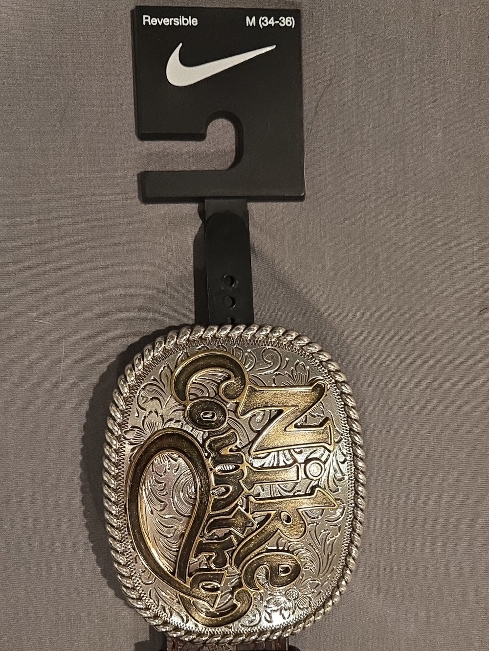 Nike Silver and Gold Decorative Buckle Accent